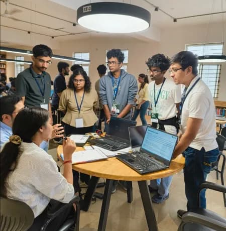 Reviewers discussing a hackathon project